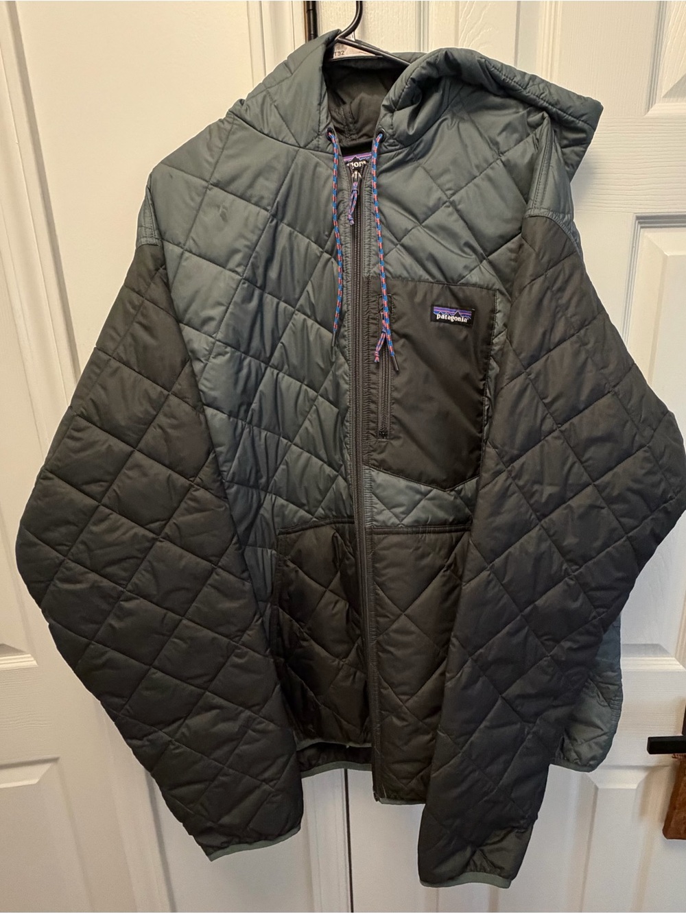 Patagonia Quilted Hooded Puffer Jacket in Dark Green and Black